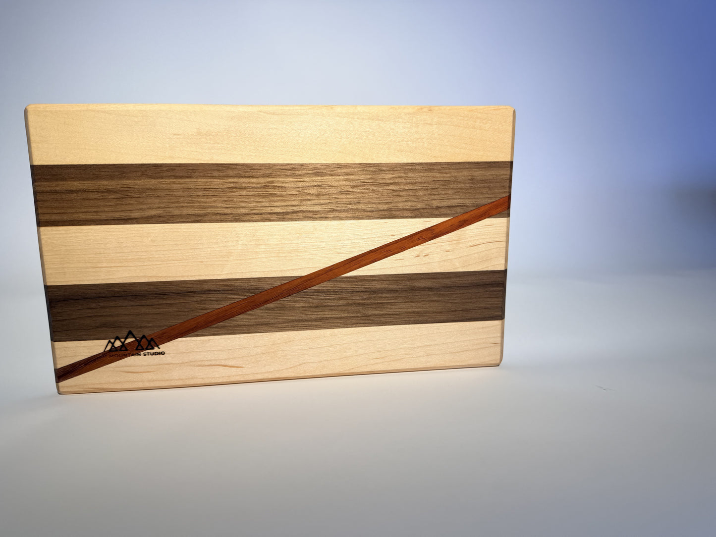 Short Cuts board top view with diagonal padauk line