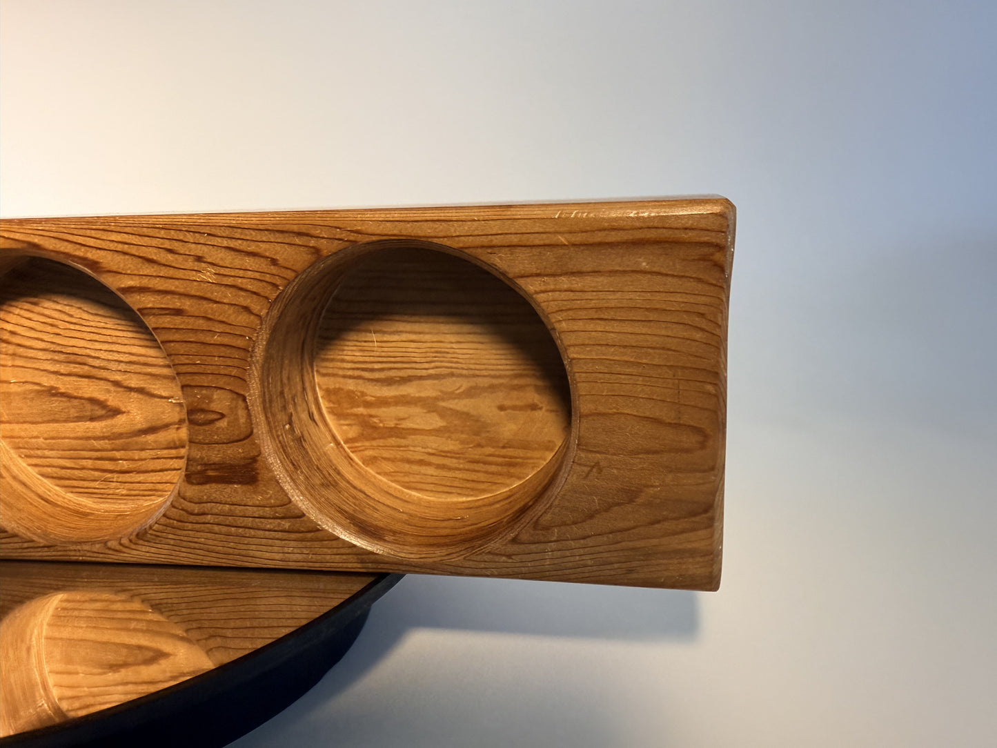 Close-up of carved candle well and Douglas fir grain