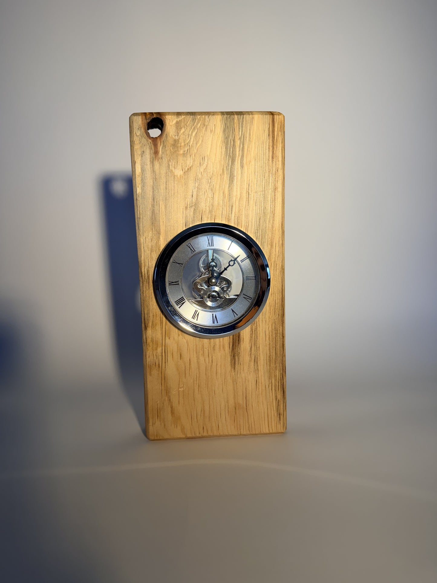 Cottonwood desk clock, angled view on blue studio backdrop