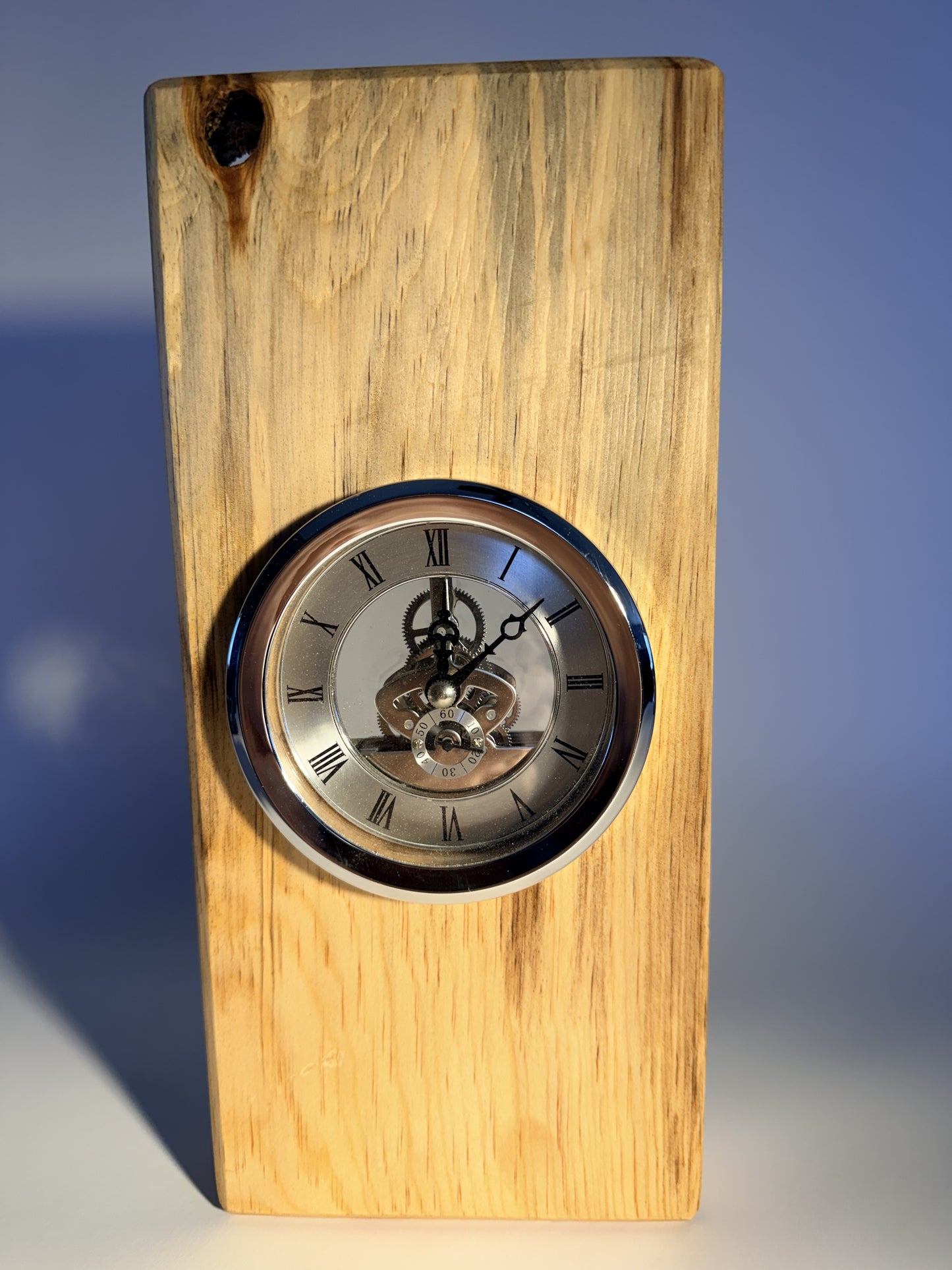 Cottonwood desk clock showing grey-streaked grain and inset clock face
