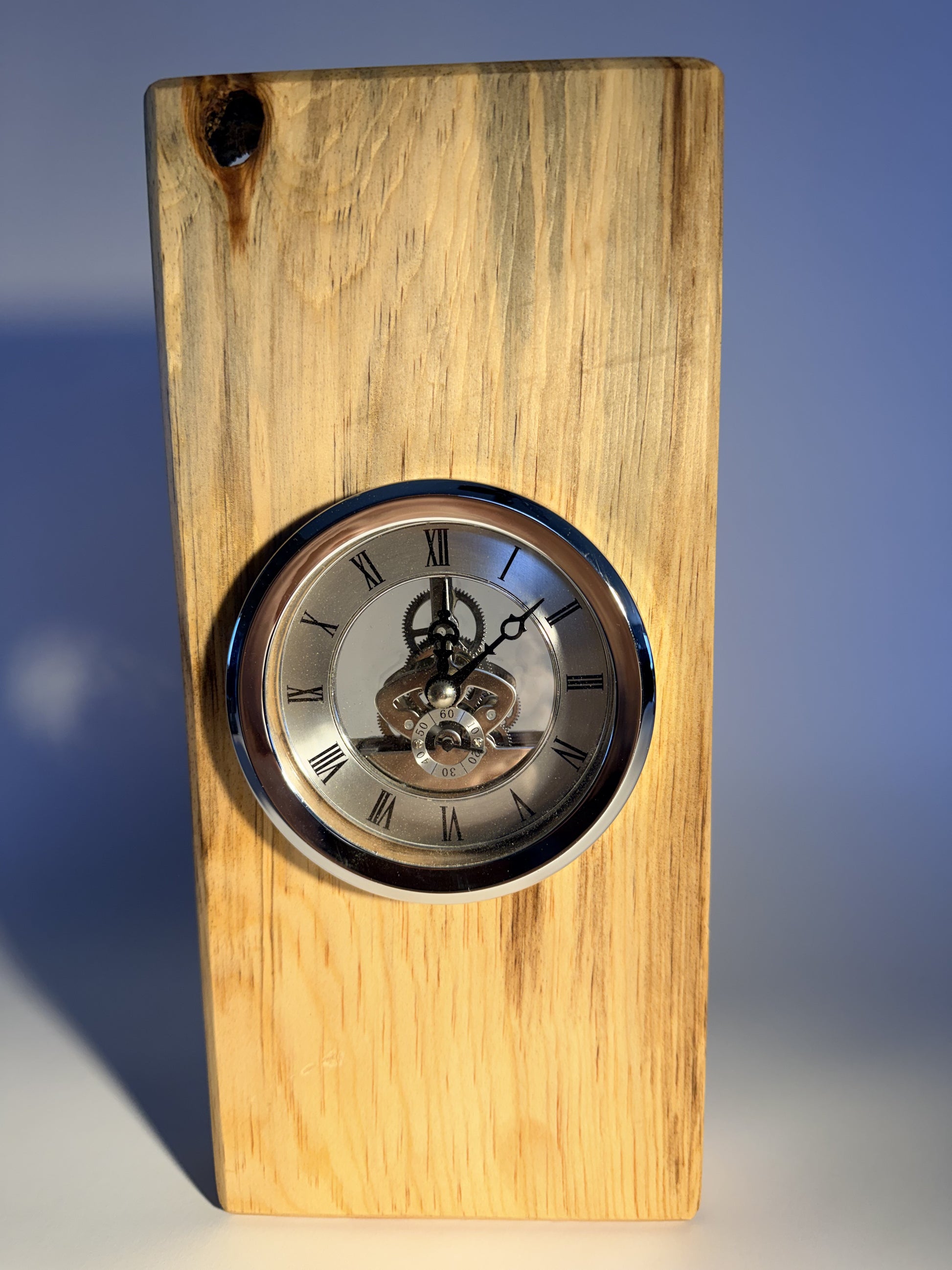 Cottonwood desk clock showing grey-streaked grain and inset clock face