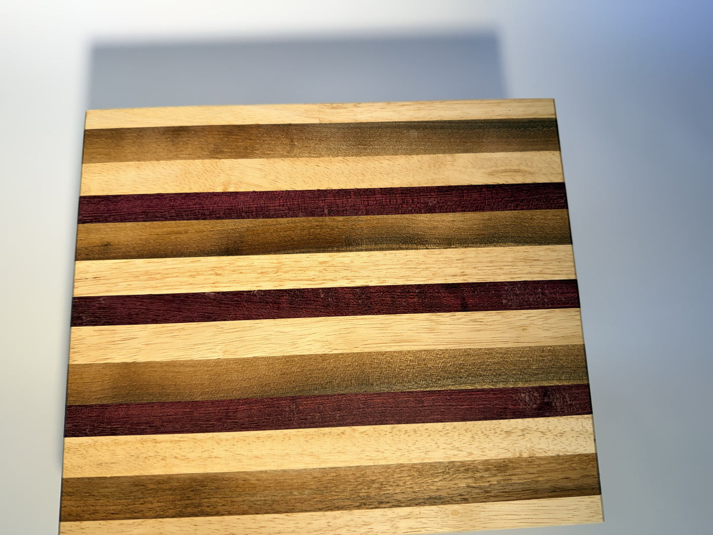 Short Cuts walnut, maple and padauk board, three-quarter view