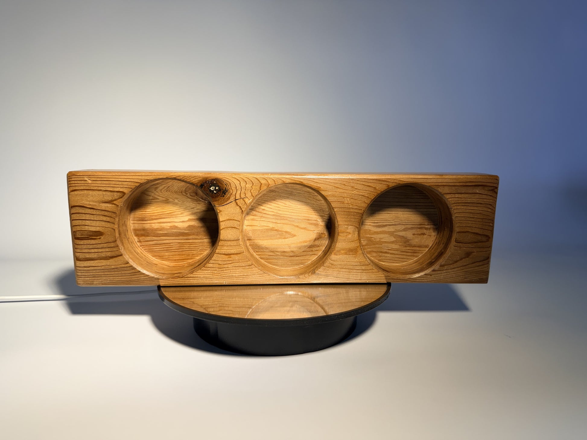 Douglas fir candle holder angled view showing three carved wells