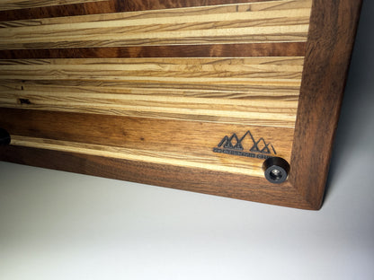 Walnut frame and striped grain with branded logo — close-up