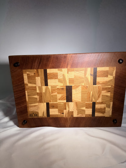 End-grain mosaic cutting board — back with logo and rubber feet