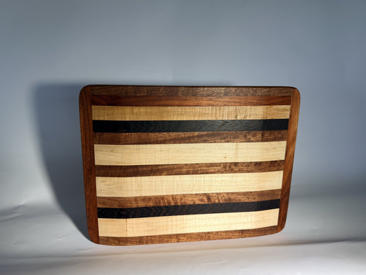 Arrows Board five-wood cutting board standing upright, hero view