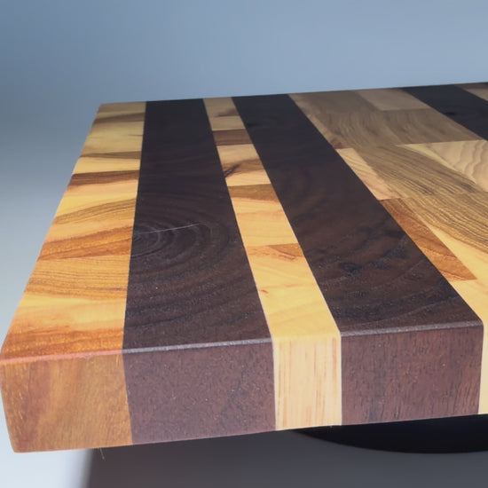 End-grain walnut and oak striped board — rotating flat view